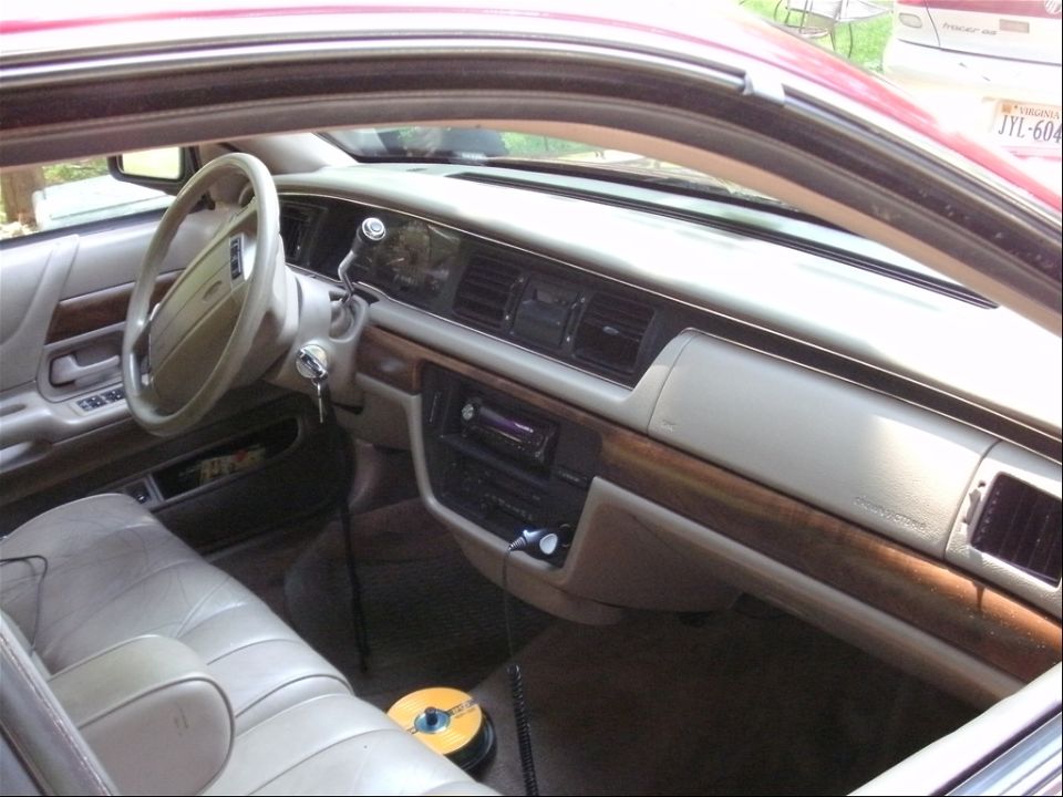 Interior of a 1994 Ford Crown Victoria, showing dashboard and seats