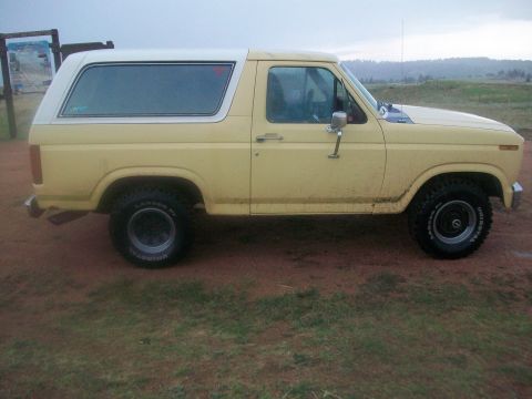 1986 Ford Bronco - This SUV has a removable white top and off-road tires.