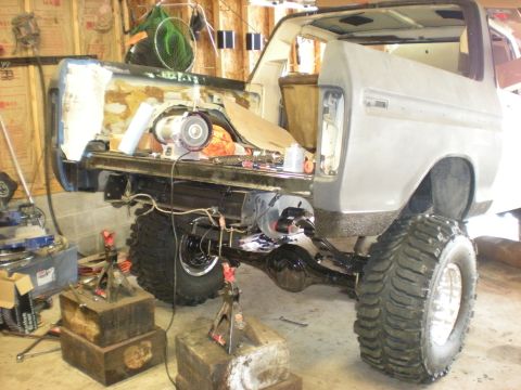 1978 Ford Bronco - This 1978 Ford Bronco is in a garage, with its rear end elevated on jack stands for repairs.