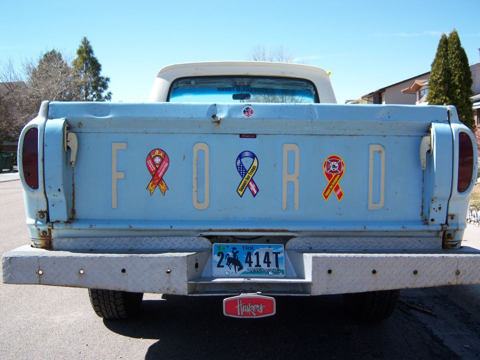 1963 Ford F-100 tailgate with awareness ribbons and Nebraska license plate