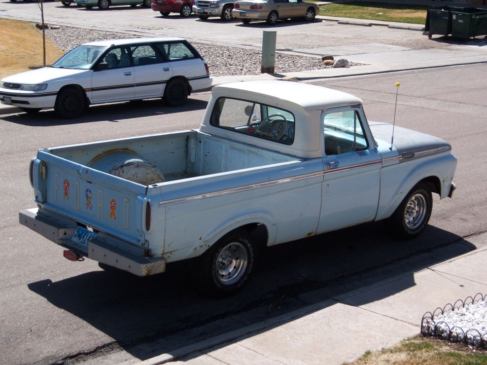 Light blue 1963 Ford F-100 pickup truck, 3/4 front view