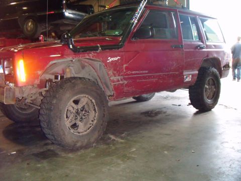 1998 Jeep Cherokee - This 1998 Jeep Cherokee Sport is equipped for off-road adventures with its snorkel and large tires.
