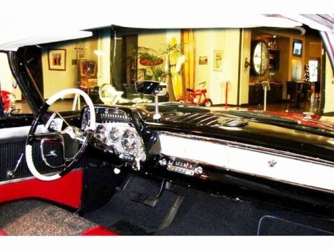 1991 Ford Crown Victoria - The interior of a classic 1957 Mercury Montclair features a two-tone steering wheel and a chrome-accented dashboard.