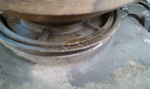 1992 Ford Bronco - A close-up view of a greasy metal part, showing wear and tear.