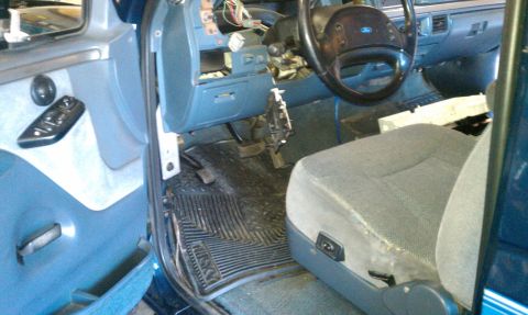 1992 Ford Bronco - Interior view of a 1992 Ford Bronco with the dashboard disassembled for repair.