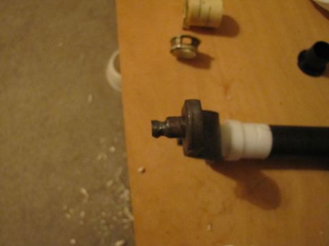 1993 Ford F-250 - Clutch linkage part shown with tape wrapped around it, possibly for repair or modification.