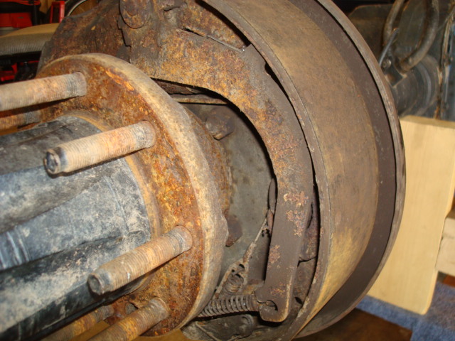 Rear axle drum brake assembly with heavily rusted components