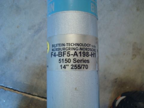 1995 Ford Bronco - Close-up of a Bilstein shock absorber, part number F4-BF5-A198-H1, from the 5150 Series.