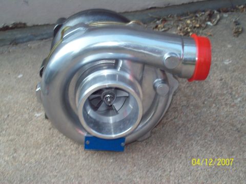 1995 Ford Probe - A turbocharger is shown, a component that forces air into an engine.