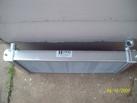 1995 Ford Probe - An aluminum radiator with a Howe label is shown, likely a replacement part.