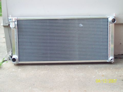 1995 Ford Probe - A new aluminum radiator is shown resting on a concrete surface, with a watermark indicating it was photographed in 2007.