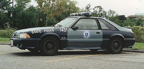 1998 Ford Crown Victoria - This Massachusetts State Police vehicle, marked with number 1451, is a Ford Mustang, not a Crown Victoria.