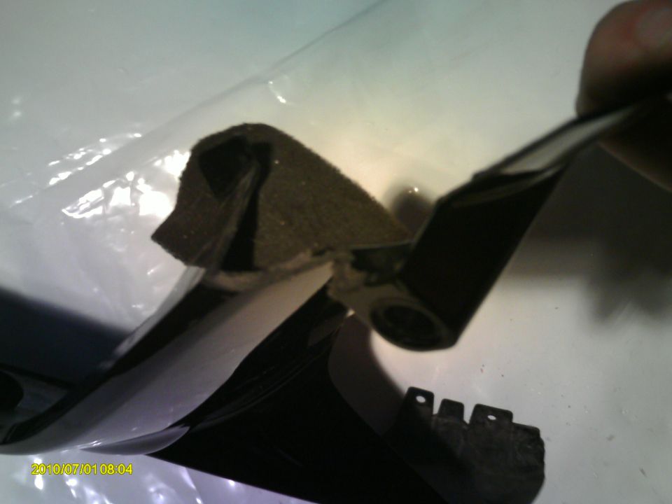 Black and white vehicle part with foam padding