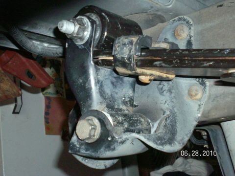1996 Ford Bronco - Underside view of a vehicle's driveshaft support bracket assembly.