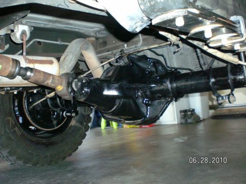 1996 Ford Bronco - Underside view of a vehicle's rear differential and driveshaft assembly.