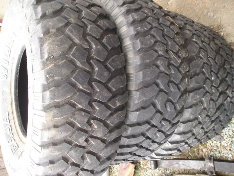 1990 Toyota Pickup/SR5 - Two off-road tires are shown, likely for a truck or SUV, with visible tread detail.