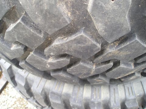 1990 Toyota Pickup/SR5 - Close-up of aggressive off-road tire tread pattern, showing deep lugs.