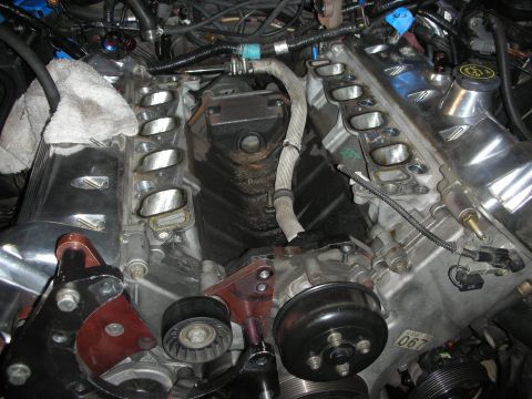 1992 Ford Crown Victoria - Engine components during a rebuild, likely a Ford V8, with intake ports exposed.