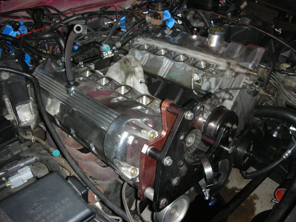Engine with chrome valve covers and aftermarket pulley system