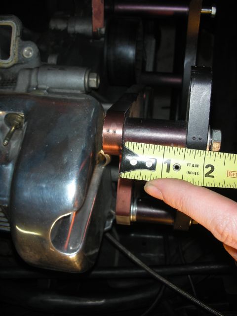 1992 Ford Crown Victoria - A close-up view shows an engine component being measured with a tape measure, indicating approximately 1 inch.