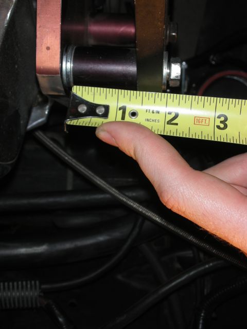 1992 Ford Crown Victoria - Measuring engine component with a tape measure. The reading is under 1 inch.