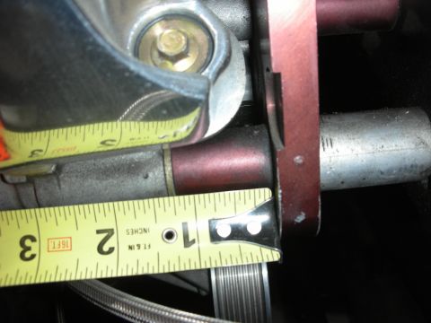 1992 Ford Crown Victoria - A close-up view of an engine component with a measuring tape indicating a dimension.