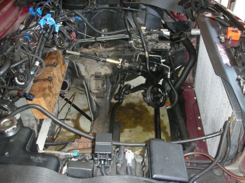 1992 Ford Crown Victoria - The engine bay is partially disassembled, showing the internal components and wiring harness.