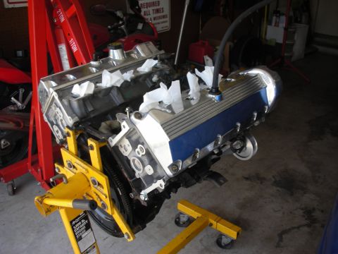 1992 Ford Crown Victoria - Engine assembly with blue and chrome valve covers is mounted on an engine stand.