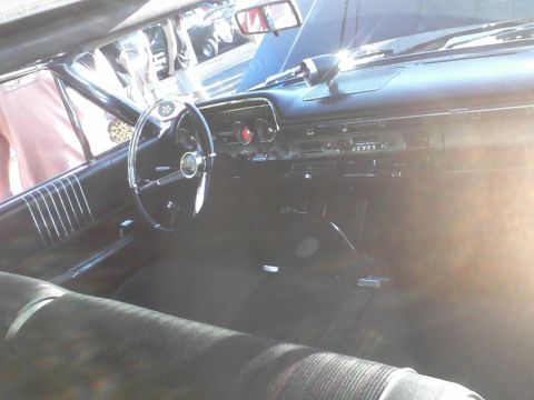 1960 Ford Falcon - The interior of a 1960 Ford Falcon shows its classic dashboard and steering wheel.