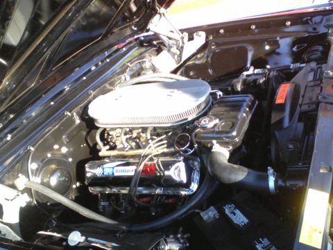 1960 Ford Falcon - Engine bay of a 1960 Ford Falcon, showing the V8 engine and associated components.