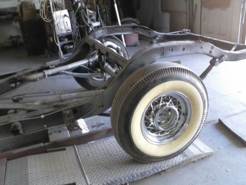 1960 Ford Falcon - The chassis of a car is visible, with a focus on the rear wheel assembly.