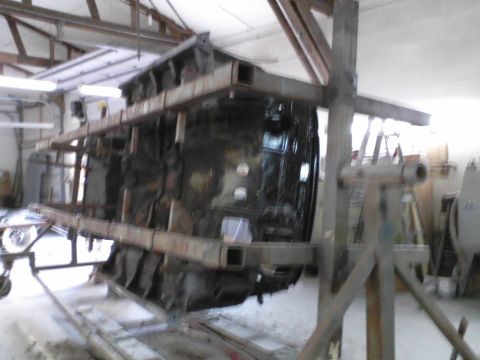1960 Ford Falcon - Vehicle body is mounted on a rotisserie for repair or restoration work.