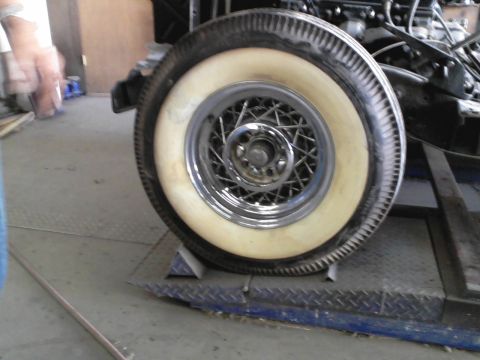 1960 Ford Falcon - Close-up of a wire wheel and whitewall tire, with Supermotors.net logo in the corner.