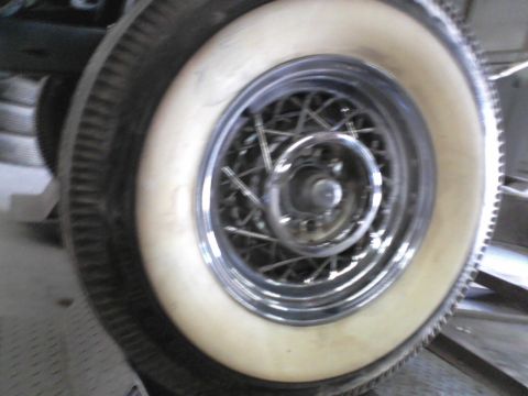 1960 Ford Falcon - Close-up of a whitewall tire and a chrome wire wheel, with a Supermotors.net watermark.