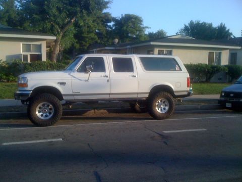 1996 Ford C-350 (Centurion Conversions) - This modified SUV features an extended cab and a long rear cargo area, suggesting a custom conversion.