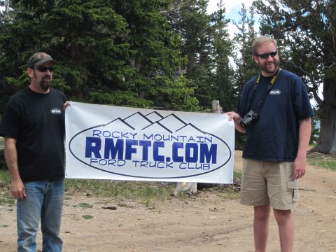 1978 Ford F-150 - Two men pose for a photo while holding a banner for the Rocky Mountain Ford Truck Club.