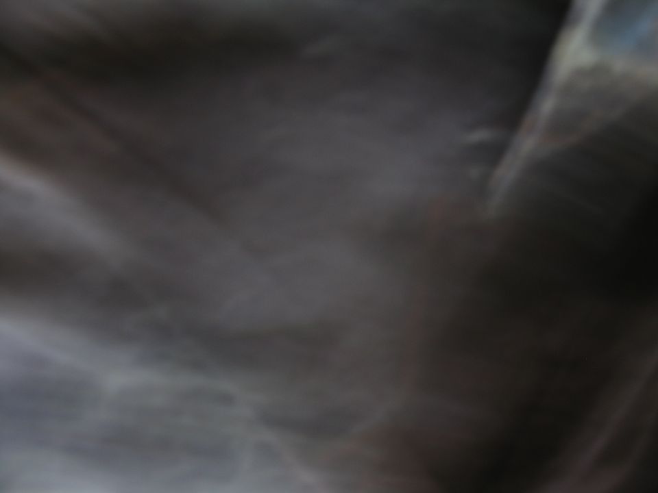 dark interior shot, looks like a dashboard or seat area