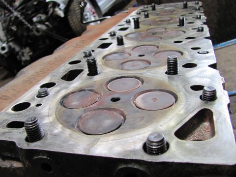 2005 Dodge 3500 - Close-up of an engine cylinder head, showing valves and mounting points.