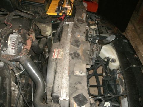 1998 Lincoln Mark VIII - Close-up view of a car's engine bay, showing various components and wiring.
