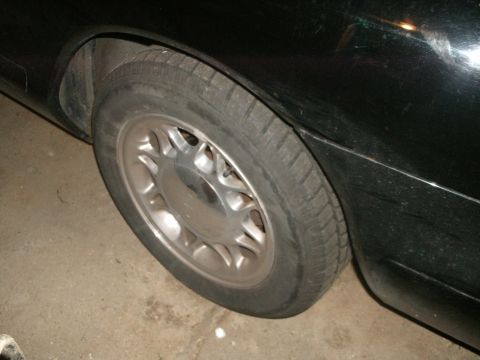 1998 Lincoln Mark VIII - Close-up of the rear wheel and fender of a 1998 Lincoln Mark VIII.