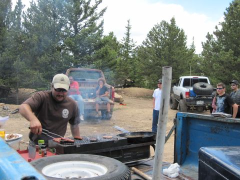 1978 Ford F-150 - Outdoor gathering with friends and multiple trucks present.