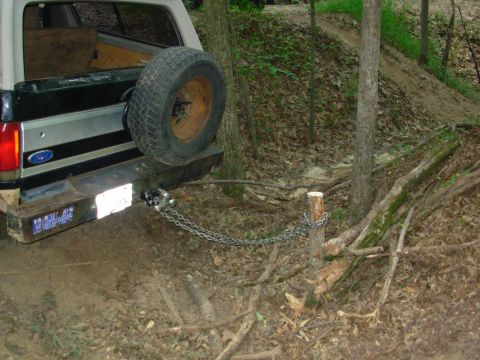 1983 Ford Bronco - Yesterday, Greg & I decided that this tree was in the way, so after chain-sawing it down to ~2 feet, I chained onto it. Greg's Disco is cur…