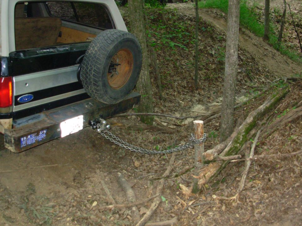 Yesterday, Greg & I decided that this tree was in the way, so after chain-sawing it down to ~2 feet, I chained onto it.  Greg's Disco is currently down waiting for a replacement shock.