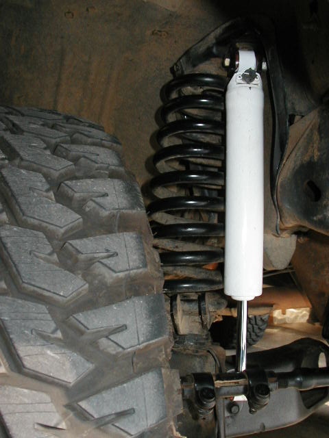 1995 Ford Bronco - Front shock...had to flip it due to knuckle under project and clearance between the rancho firmness setting knob and the steering rod. EDIT…