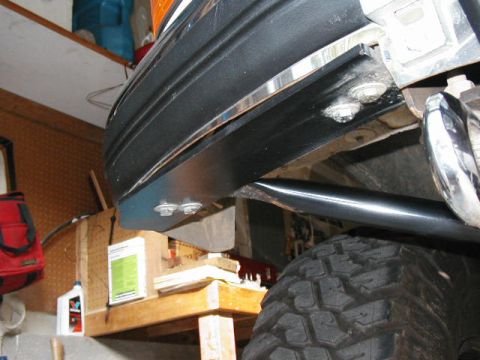 1995 Ford Bronco - Detail of vehicle bumper and tire, likely showing modifications or repairs.