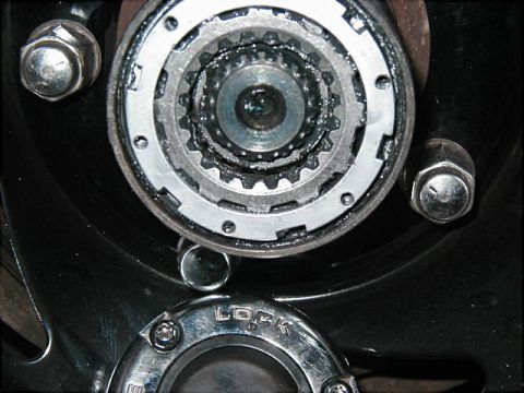1995 Ford Bronco - The internal gears of a locking hub are visible, with the word 'LOCK' clearly marked on the exterior dial.