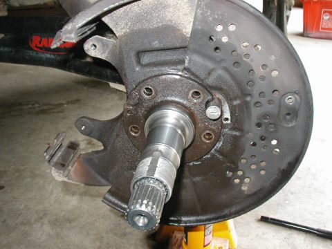 1995 Ford Bronco - Vehicle hub and brake rotor assembly, likely undergoing maintenance or repair.