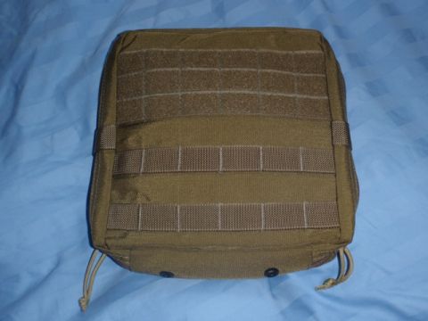 1991 Ford Bronco - A tan tactical pouch with MOLLE webbing and drawstrings is shown against a blue background.