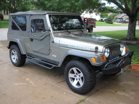 2005 Jeep Wrangler - This Jeep Wrangler Rubicon is shown from a three-quarter front view, parked on a concrete driveway.