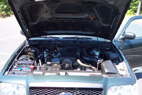 2001 Ford Crown Victoria - Engine bay of a 2001 Ford Crown Victoria, viewed from the front with the hood open.